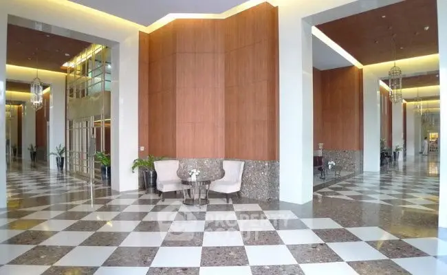 Luxurious building entrance with elegant marble flooring and modern design.