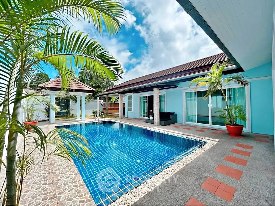 Stunning villa with private pool and lush garden, perfect for luxury living and relaxation.