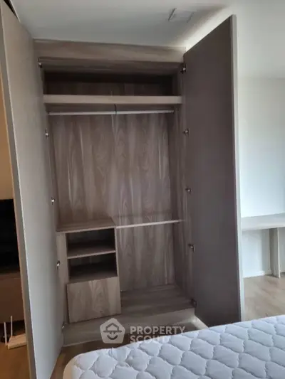 Spacious wooden wardrobe in modern bedroom with elegant design