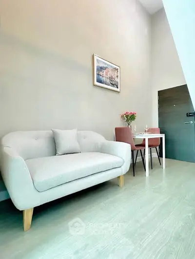 Chic modern living room with cozy sofa and dining area, perfect for urban living.