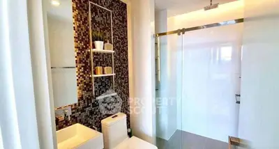 Modern bathroom with sleek design and glass shower enclosure