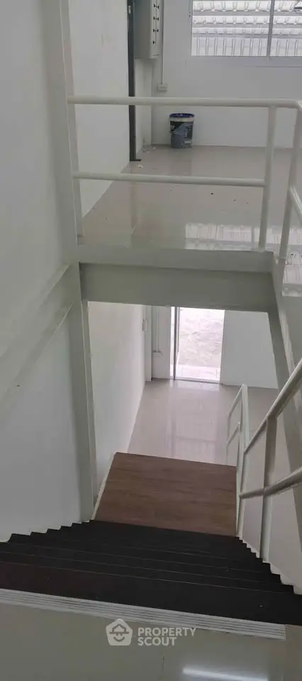 Modern staircase with sleek railing in a contemporary building interior