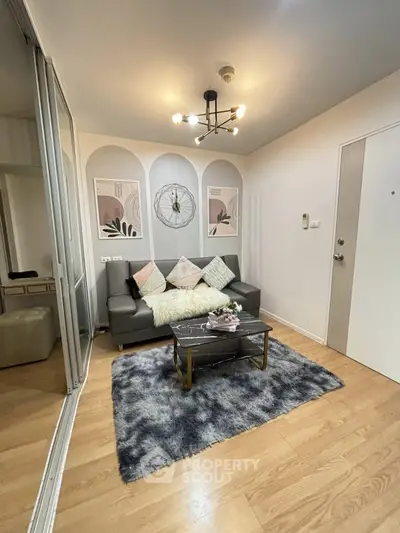 Chic modern living room with stylish decor and cozy seating area, perfect for relaxation and entertaining.