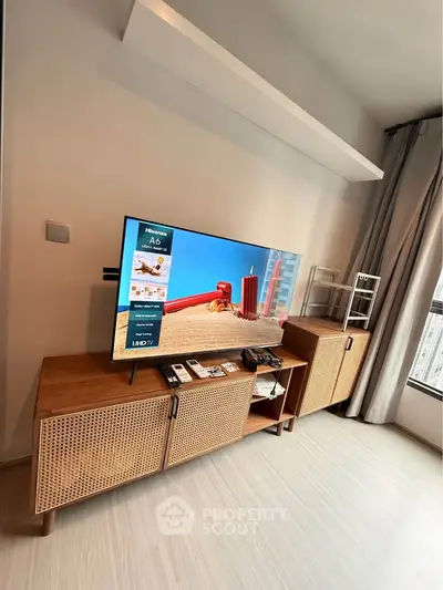 Modern living room with stylish TV stand and large window view