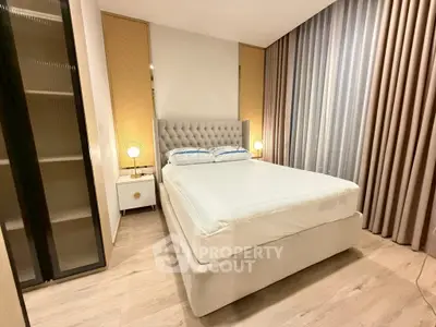 Modern bedroom with elegant decor and plush bed in a stylish apartment.