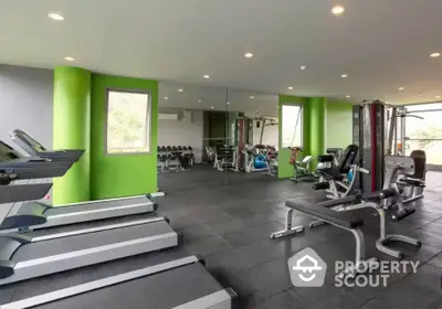 Modern gym with state-of-the-art equipment in luxury residential complex