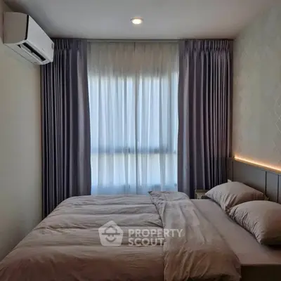 Cozy bedroom with modern design and soft lighting, featuring a comfortable bed and elegant curtains.
