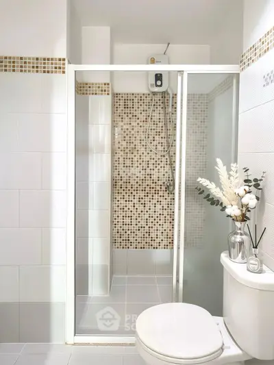 Modern bathroom with glass shower and elegant tile design