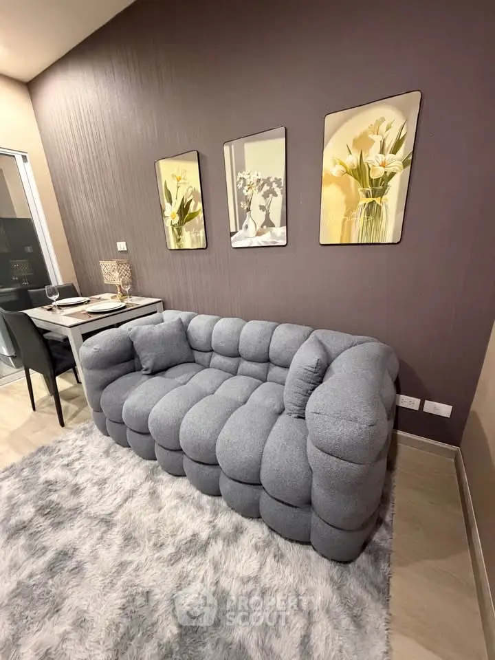 Stylish modern living room with plush gray sofa and elegant decor