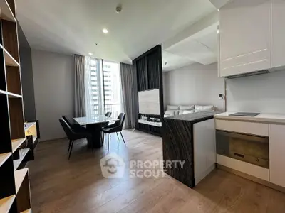 Modern open-layout living room with dining area and sleek kitchen in a high-rise apartment.