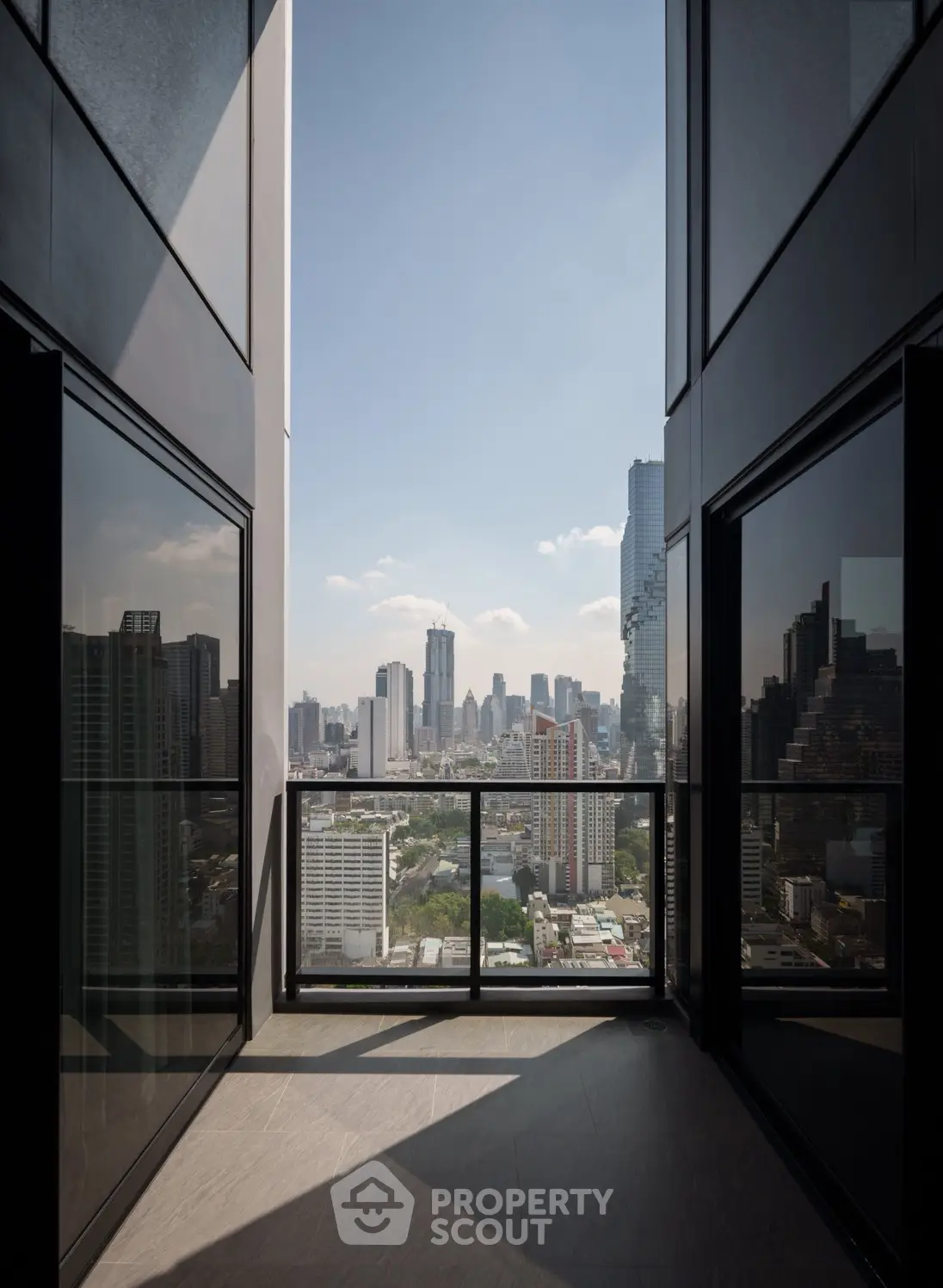 Stunning cityscape view from a modern high-rise balcony, perfect for urban living.