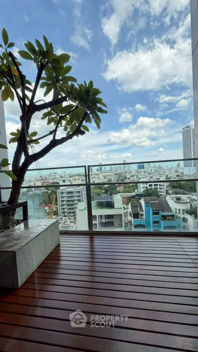Stunning balcony with panoramic city view and wooden deck flooring.
