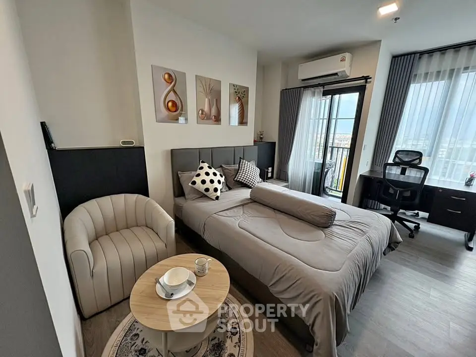 Modern bedroom with stylish decor and city view balcony