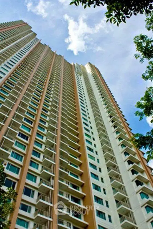 Stunning high-rise building with modern architecture against a clear blue sky.