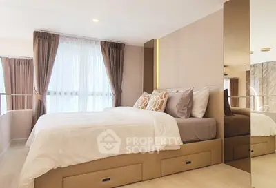 Modern bedroom with stylish decor and large windows for natural light