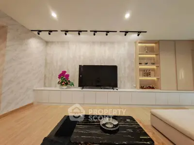 Modern living room with sleek TV setup and elegant decor