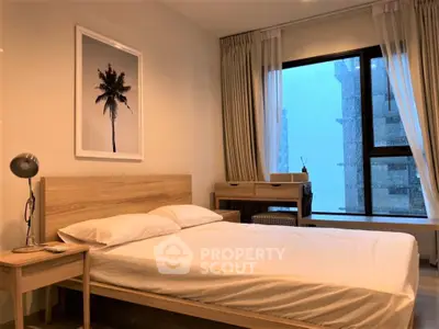 Cozy bedroom with modern decor and large window view