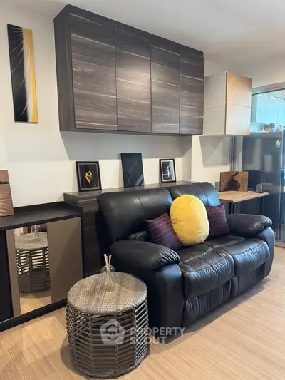 Stylish living room with modern decor and cozy seating in a contemporary apartment.