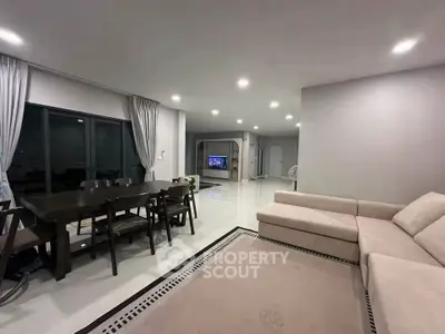 Spacious modern living room with elegant dining area and cozy sectional sofa