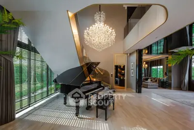 Luxurious living room with grand piano and elegant chandelier in modern home