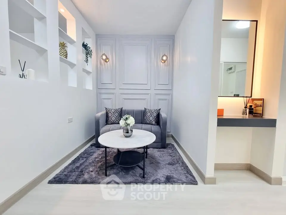 Modern living room with elegant decor and cozy seating area