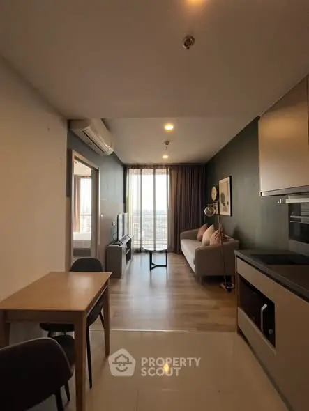 Modern living room with open kitchen and cozy decor