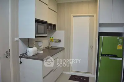 Modern kitchen with sleek appliances and closed layout design