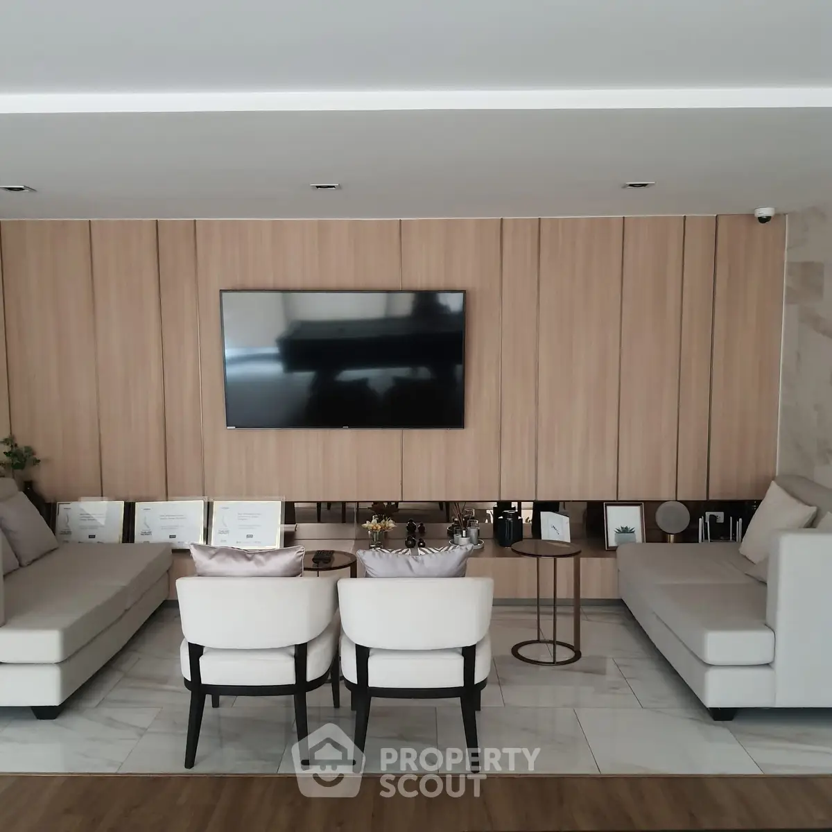 Elegant living room with modern decor and wall-mounted TV