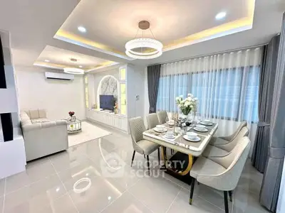 Luxurious modern living and dining area with elegant lighting and stylish decor