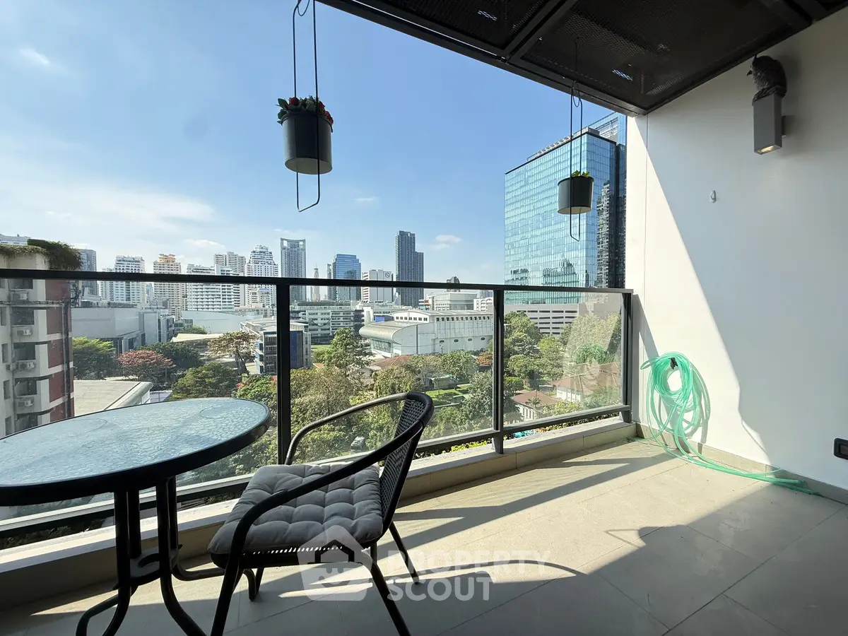 Modern balcony with city view, perfect for relaxation and enjoying the skyline.