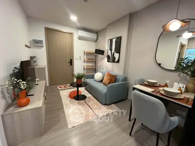 Modern living room with stylish decor, cozy sofa, and dining area in a contemporary apartment.
