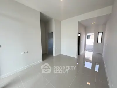 Spacious modern interior with glossy tiled floors and high ceilings, perfect for customization.