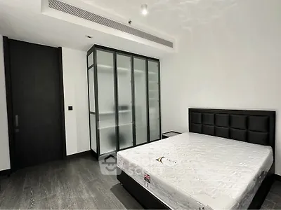 Modern minimalist bedroom with sleek design and ample storage space