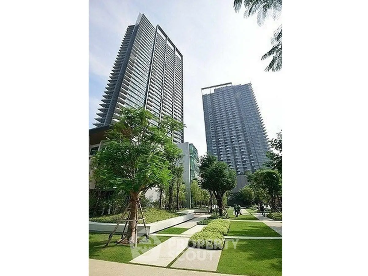 Luxurious high-rise residential towers with lush landscaped gardens and modern architecture.