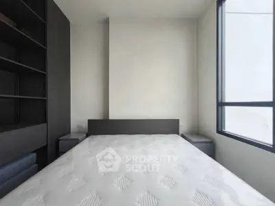 Modern minimalist bedroom with large window and built-in shelving