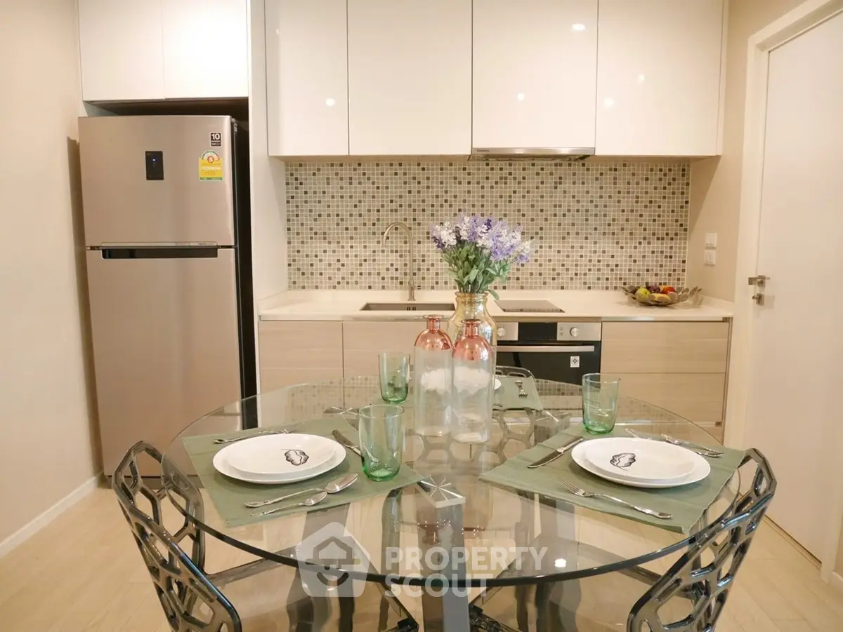 Modern kitchen with glass dining table and stylish decor