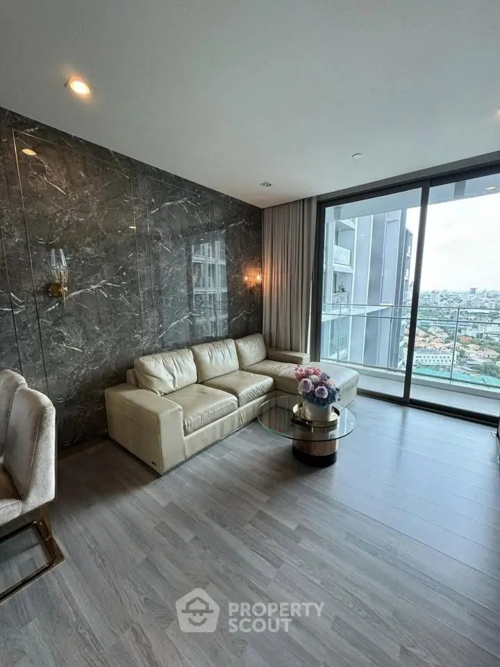 Luxurious living room with stunning city view and elegant marble wall