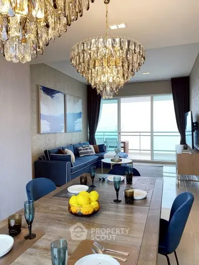 Luxurious living room with elegant chandeliers and ocean view balcony