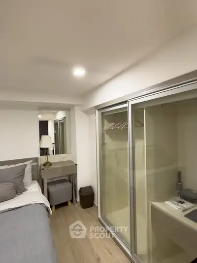 Modern bedroom with sliding closet doors and stylish decor