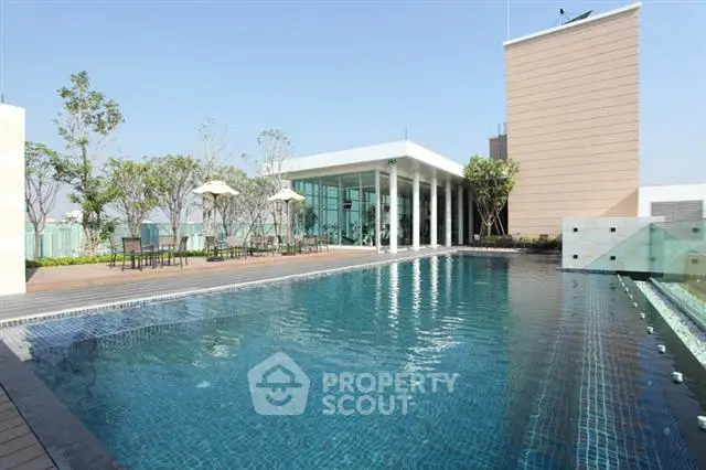 Luxurious rooftop pool with modern design and stunning city views, perfect for relaxation and entertainment.