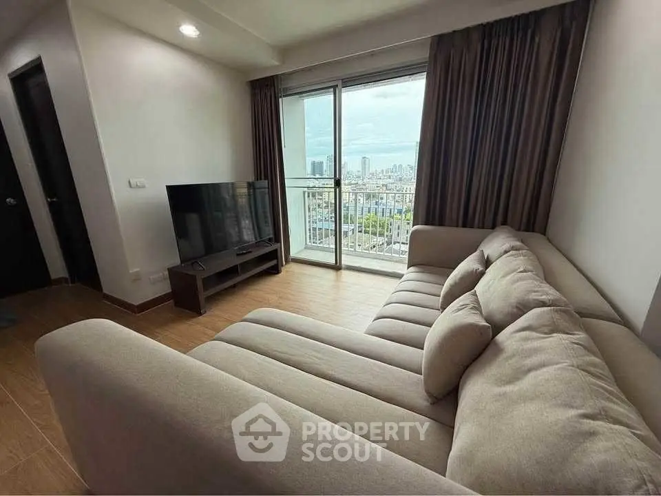 Spacious living room with city view and modern furnishings