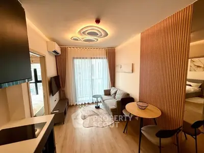 Modern living room with stylish lighting and cozy furniture in a contemporary apartment.
