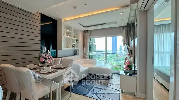 Modern living room with dining area and large windows offering a stunning city view.