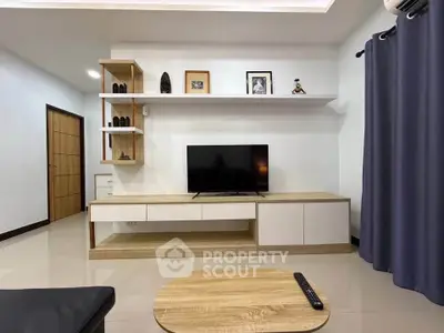 Modern living room with sleek TV stand and minimalist decor