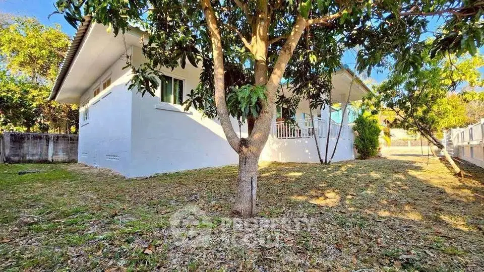 Charming single-story home with lush garden and mature trees, perfect for nature lovers seeking tranquility.