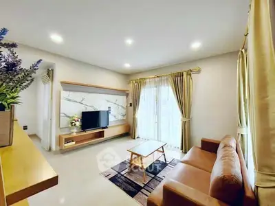 Spacious living room with modern decor and natural light