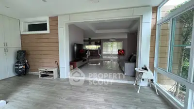 Spacious modern living room with sleek design and large windows