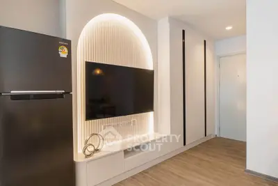 Modern living room with sleek TV setup and stylish lighting