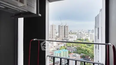 Stunning cityscape view from a high-rise balcony, perfect for urban living enthusiasts.