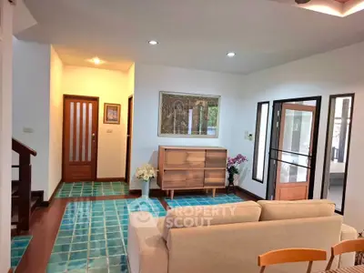 Charming living room with modern decor and vibrant turquoise flooring